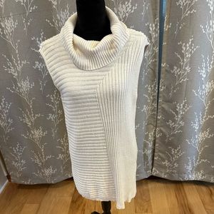 Stylus, cream sleeveless sweater, size L. Used in good condition.